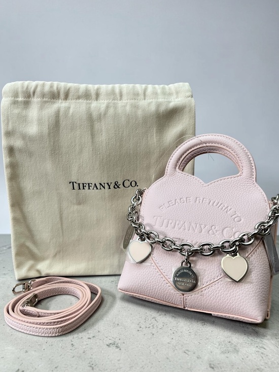 Tiffany & Co. Handbags - Authentic Tiffany & Co. Soft Pink Leather Mini Bag with Heart Charm Chain